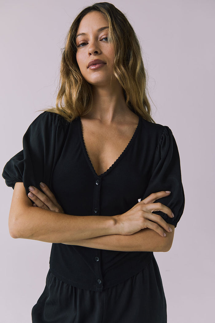 Chaser Abbie Black Blouse in a close up view focused on neckline and sleeve details