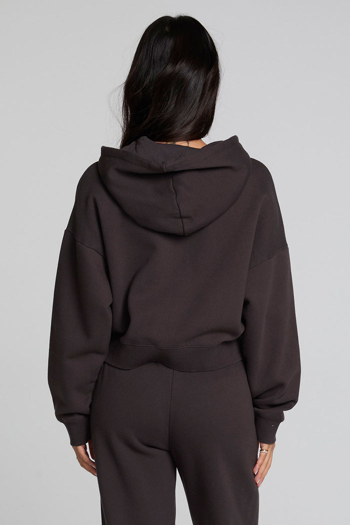 Back view of a woman wearing the Chaser  Abilene Dark Heather Grey Zip Up on a neutral background with matching pants