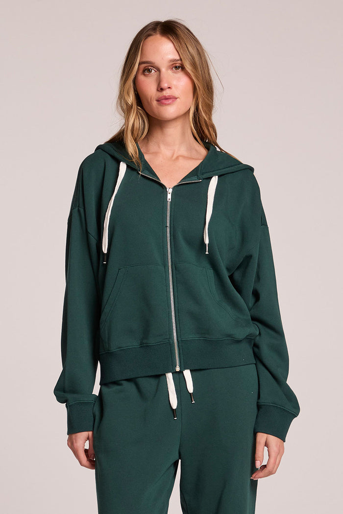 Front view of a woman wearing the Chaser  Abilene Pine Pullover and matching pants on a neutral background