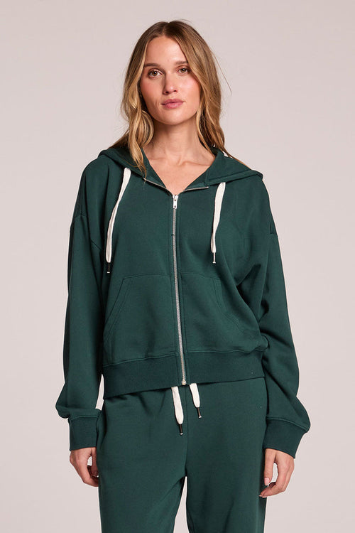 Front view of a woman wearing the Chaser  Abilene Pine Pullover and matching pants on a neutral background