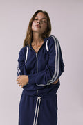 Close view of the Chaser Abilene Sapphire Zip Up focusing on the zipper and striped sleeves