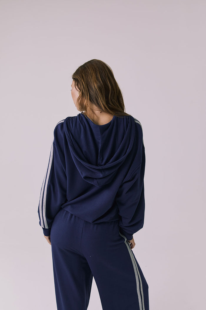 Chaser Abilene Sapphire Zip Up shown from behind with the draped hood and sleeve stripes visible
