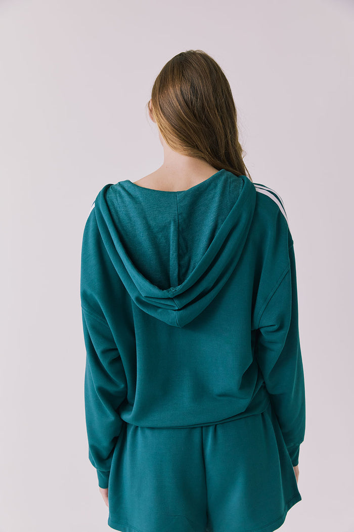 Chaser Abilenee Teal Zip Up with White Stripes shown from the back in a clean studio frame featuring the hood and stripe accents