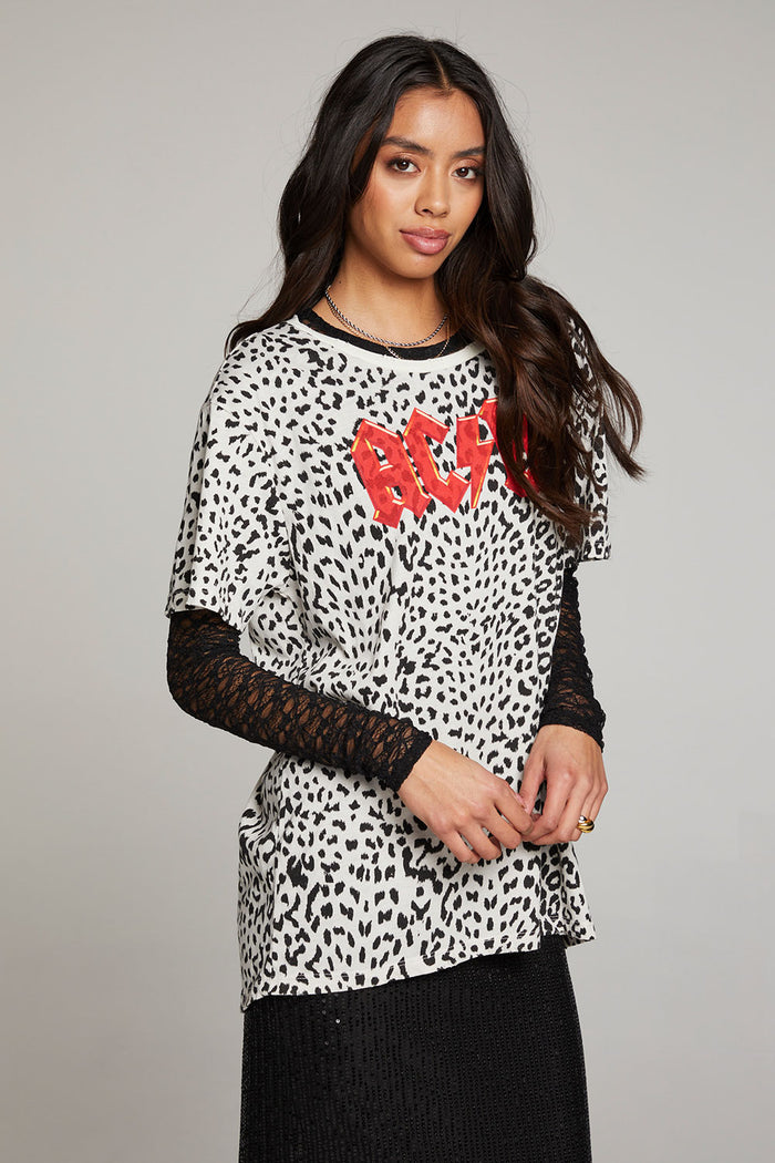 Side view of model wearing AC/DC Animal Print Logo Tee with red band logo and leopard print design against a plain background