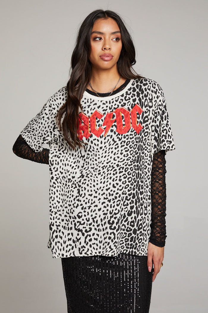 Front view of model wearing AC/DC Animal Print Logo Tee with red band logo and leopard print design against a plain background
