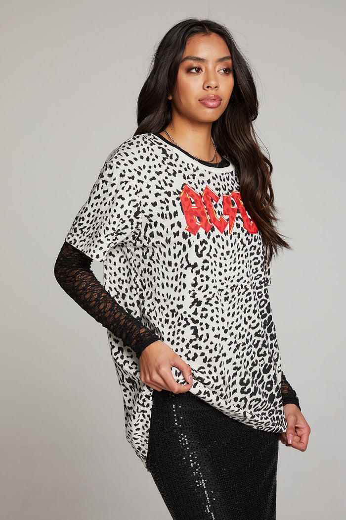 Side view of model wearing AC/DC Animal Print Logo Tee with red band logo and leopard print design against a plain background
