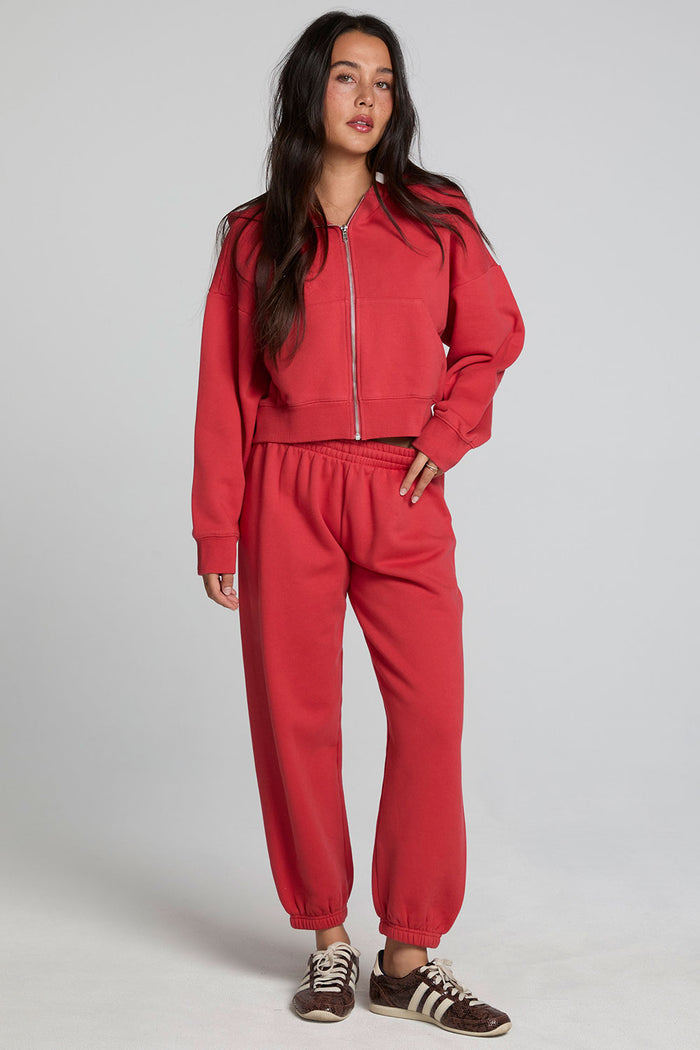 Full body front view of a woman wearing the Chaser Ada Dry Red Jogger on a neutral background