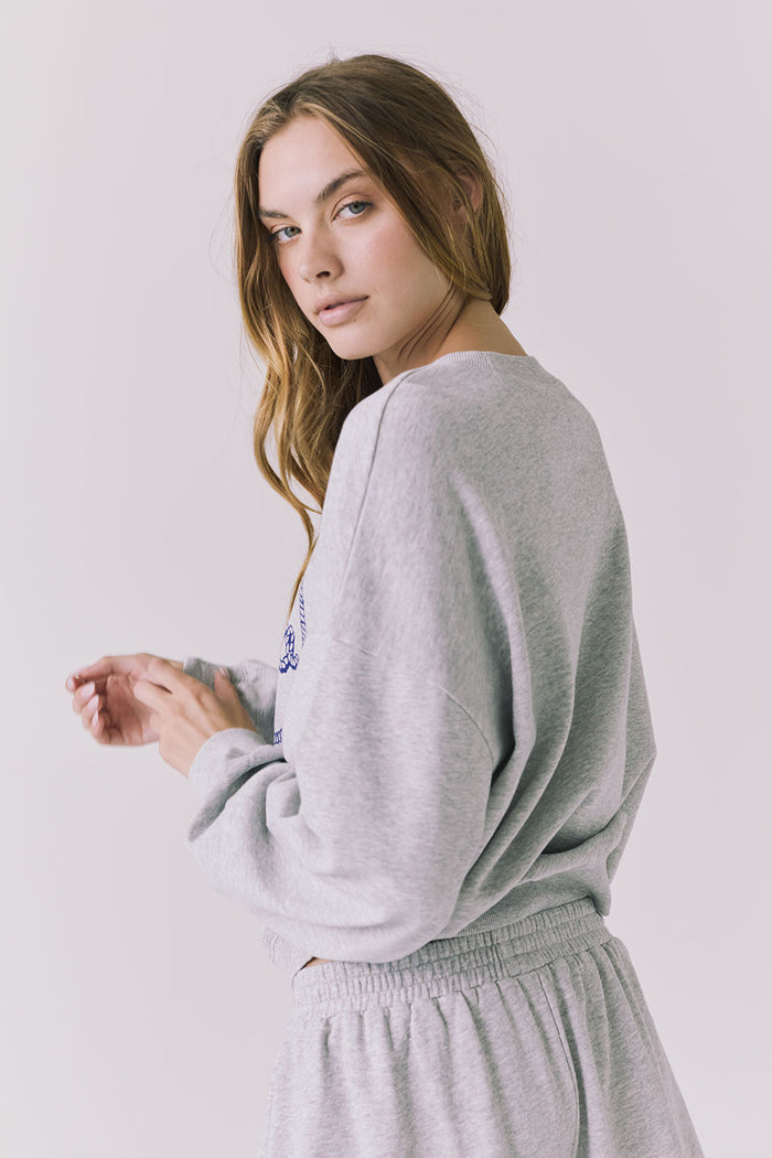 Side angle of the Chaser Ain’t My First Rodeo Heather Grey Long Sleeve showing relaxed fit