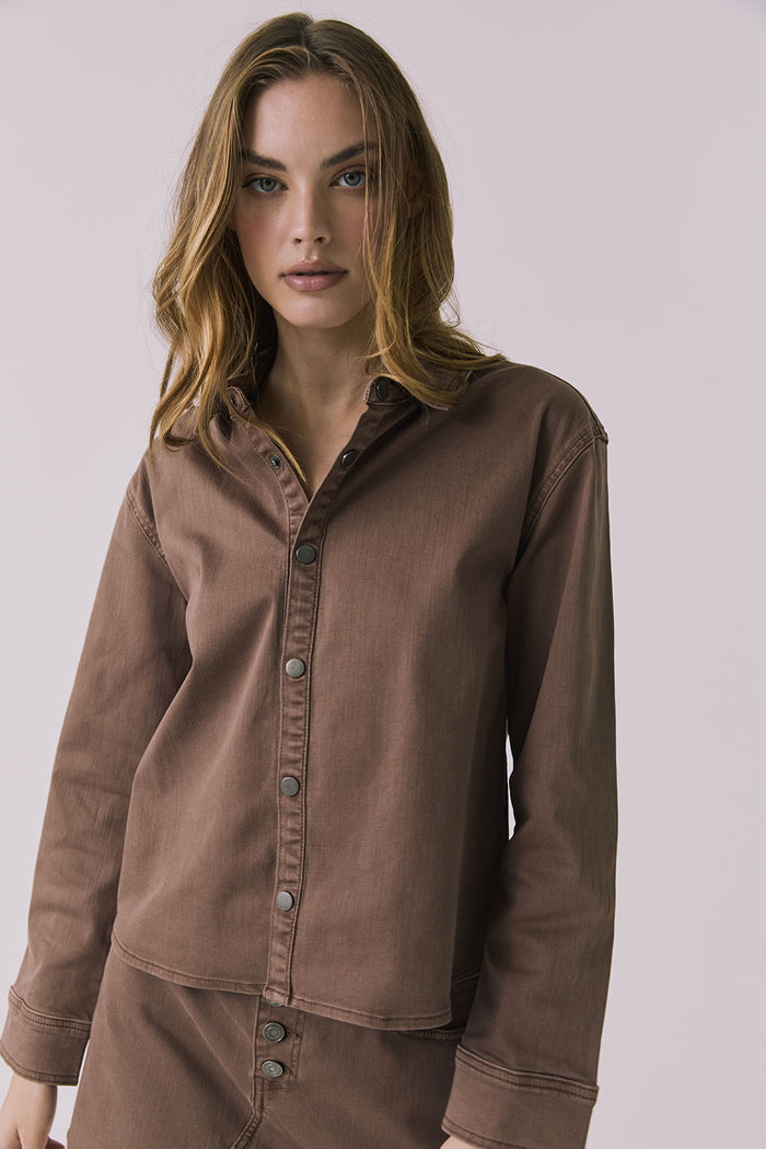 Front view of a woman wearing the Chaser brown All Day Cognac Wash Button Down against a plain background