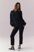 Full body view of model in Allover Icons Long Sleeve in black