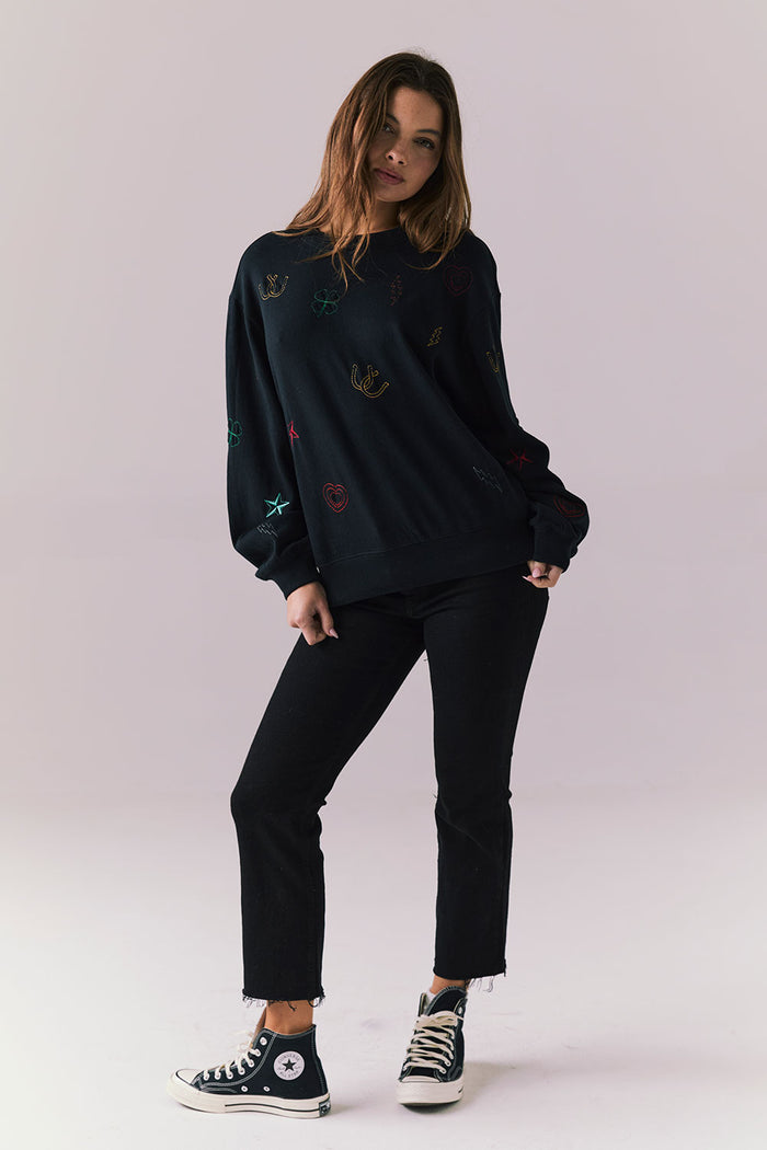 Full body view of model in Allover Icons Long Sleeve in black