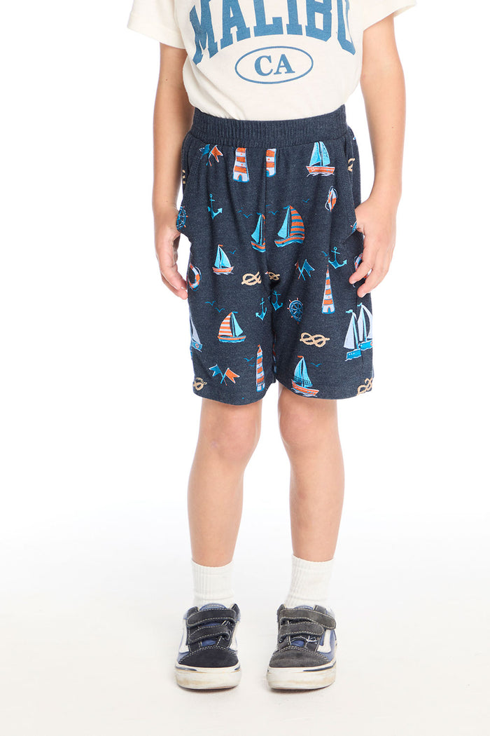 Front view of Chaser Kids Allover Sailboats Shorts in navy with colorful sailboat, anchor, and lighthouse print