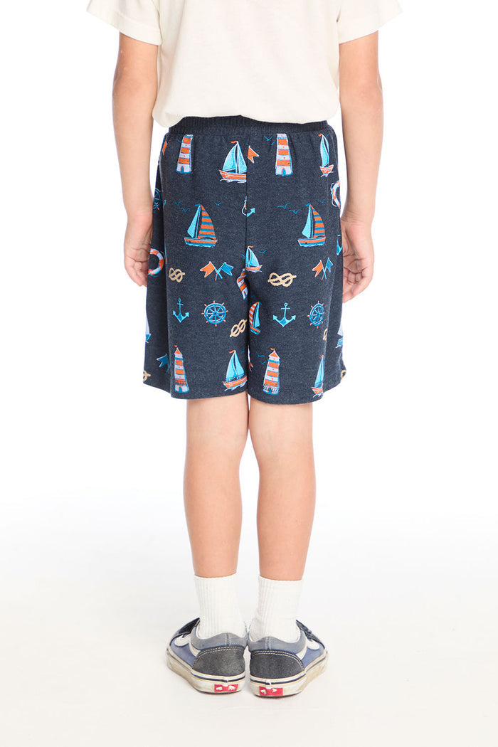 Back view of Chaser Kids Allover Sailboats Shorts highlighting the full sailboat and anchor motif across soft knit fabric