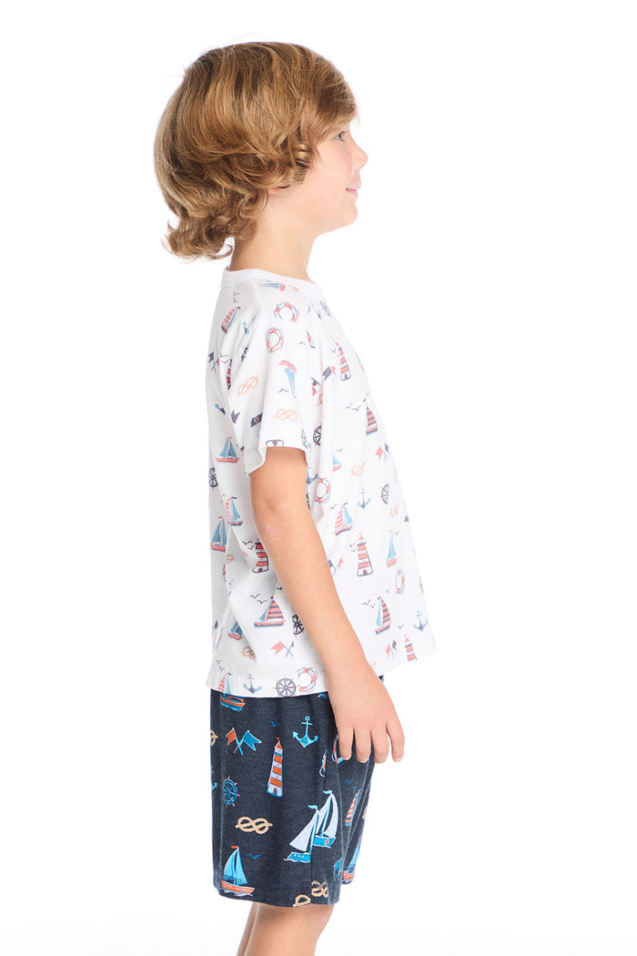Side view of the Chaser Kids Allover Sailboats Tee in white featuring the repeating sailboat pattern across the side