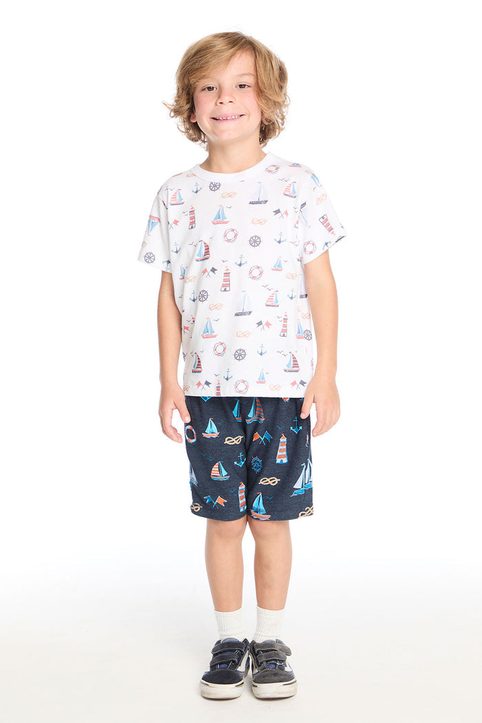 Full body view of the Chaser Kids Allover Sailboats Tee in white paired with the navy blue Allover Sailboats Shorts on a white background