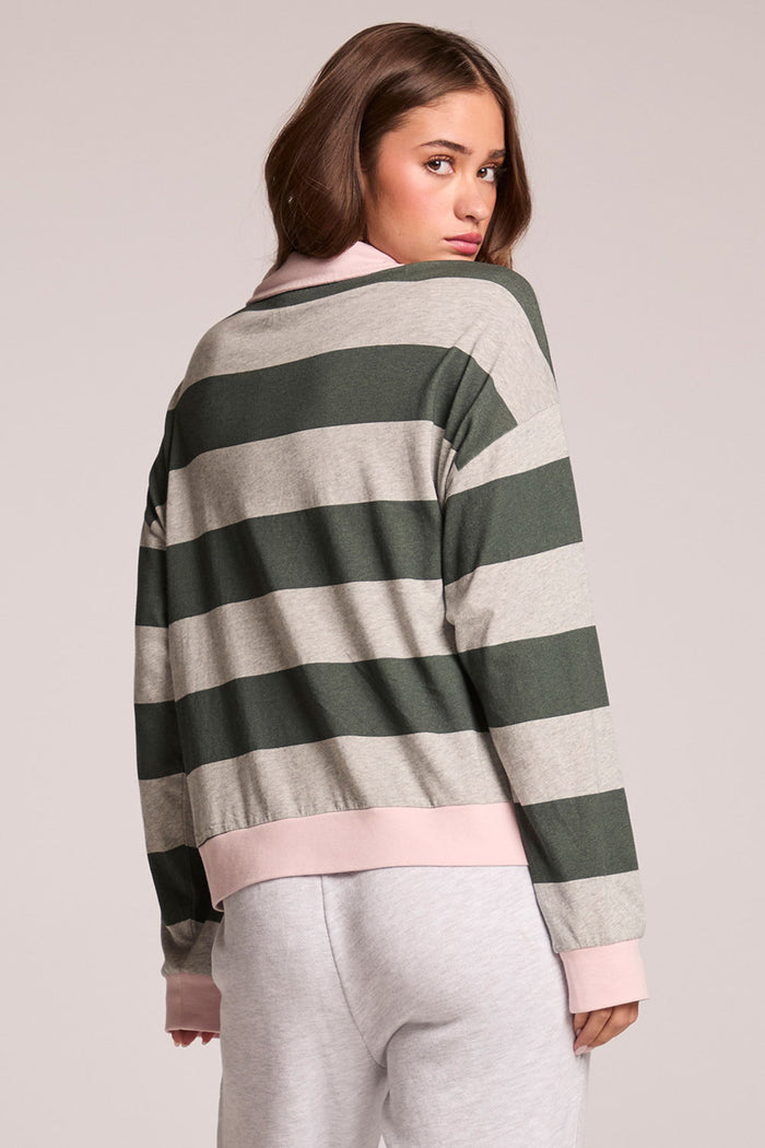 Back view of a woman wearing the Chaser Allstar 62  Long Sleeve on a neutral background