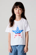Front view of a girl wearing the Chaser  Americana Star Tee on a neutral background