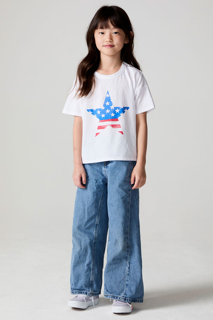 Full body front view of a girl wearing the Chaser  Americana Star Tee on a neutral background
