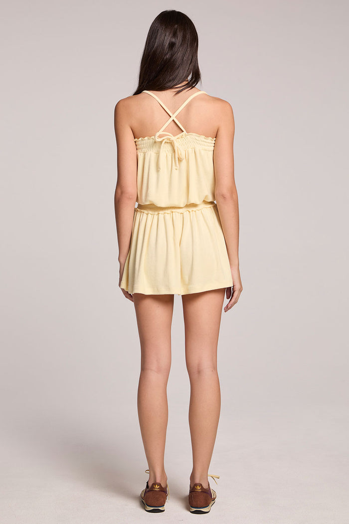 Back view of a woman wearing the Chaser    Angeline Blonde Mini Dress on a neutral background