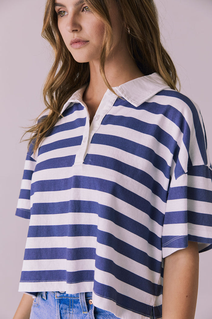 Side view of the Chaser Antoni Castaway Stripe Tee highlighting the relaxed cropped silhouette and short sleeves
