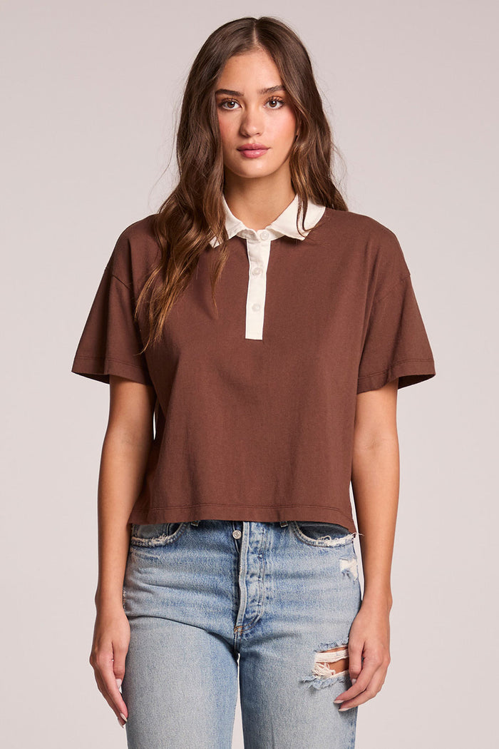 Front view of a woman wearing the Chaser Antoni Kahlua Tee and jeans on a neutral background