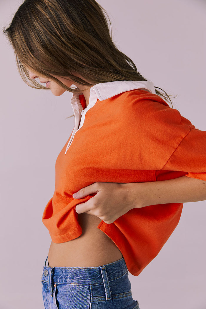 Side view of the Chaser Antoni Neon Flare Tee showing the cropped, boxy fit and lightweight cotton texture