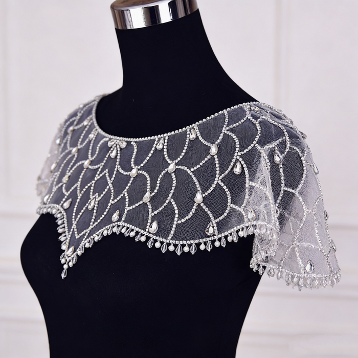 Art Deco crystal beaded bridal capelet with illusion tulle and faux pearl embroidery.