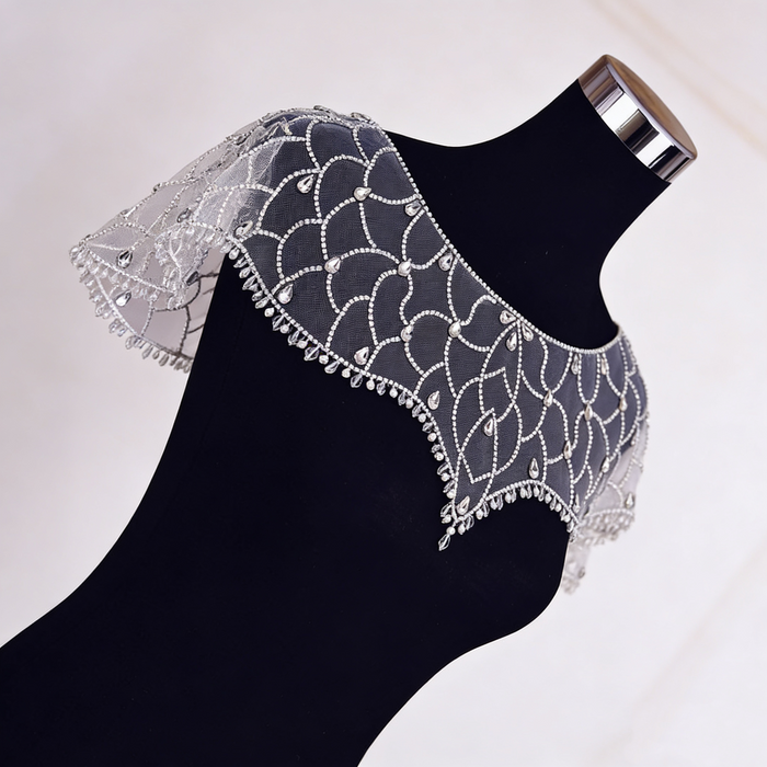 Art Deco crystal beaded bridal capelet with illusion tulle and faux pearl embroidery.