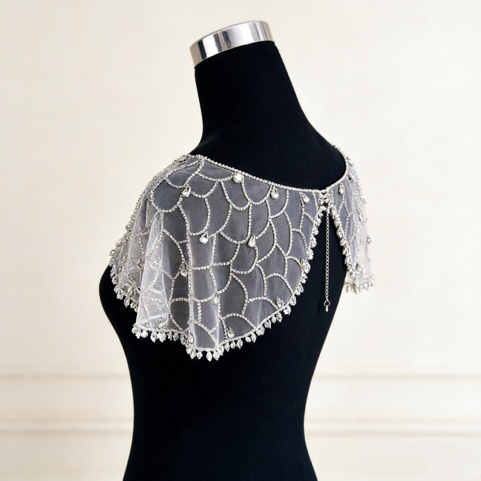 Art Deco crystal beaded bridal capelet with illusion tulle and faux pearl embroidery.