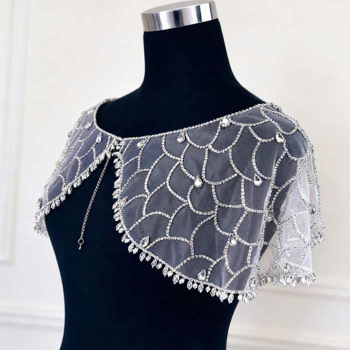 Art Deco crystal beaded bridal capelet with illusion tulle and faux pearl embroidery.