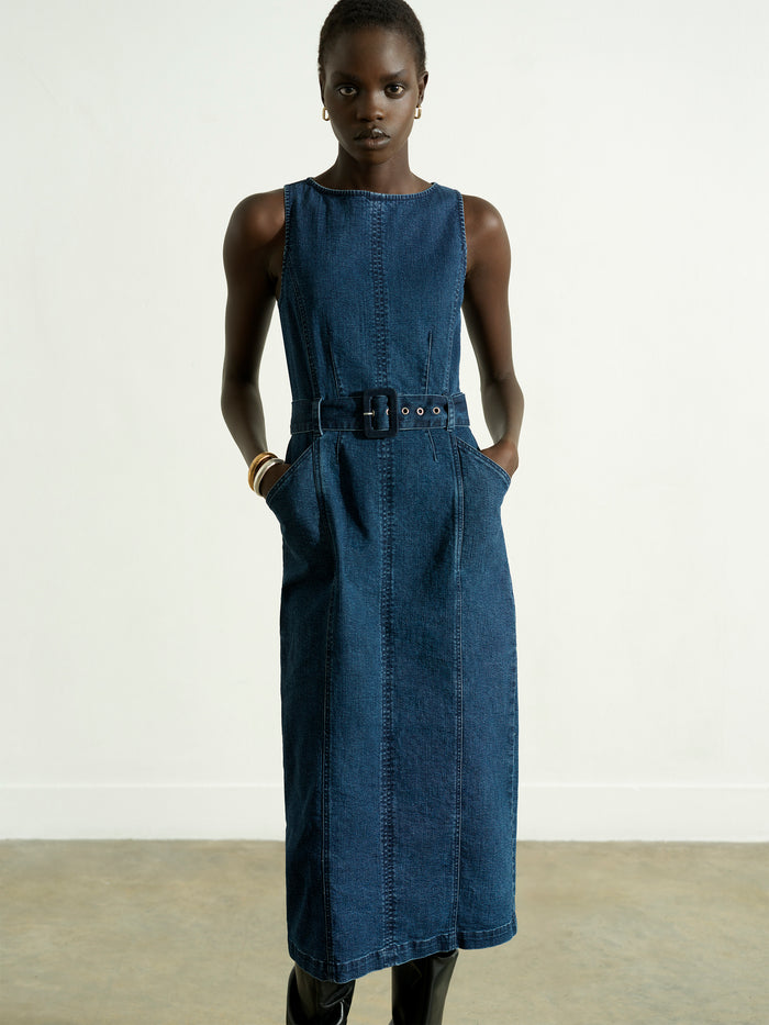 Woman wearing a blue belted denim midi dress