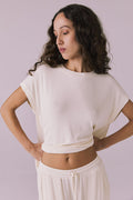 Woman wearing the Chaser Audrey Starry White Tee featuring a relaxed silhouette and rolled short sleeves in soft ribbed knit