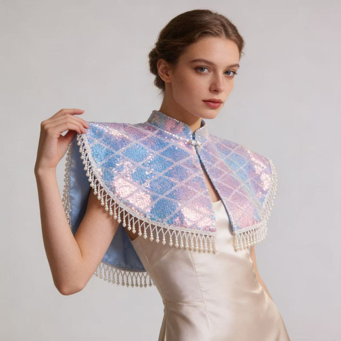 Handmade short wedding cape with pearl tassel trim and holographic sequin fabric for bridal gowns and formal occasions.
