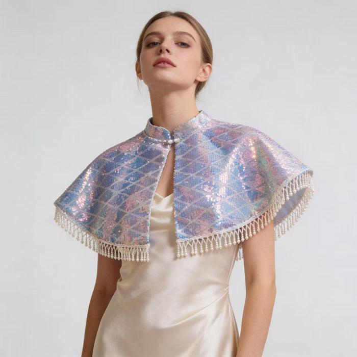 Handmade short wedding cape with pearl tassel trim and holographic sequin fabric for bridal gowns and formal occasions.