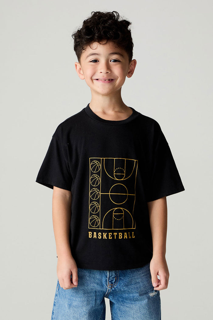 Front view of a boy wearing the Chaser  Basketball Boys Tee on a neutral background and jeans with arms lowered