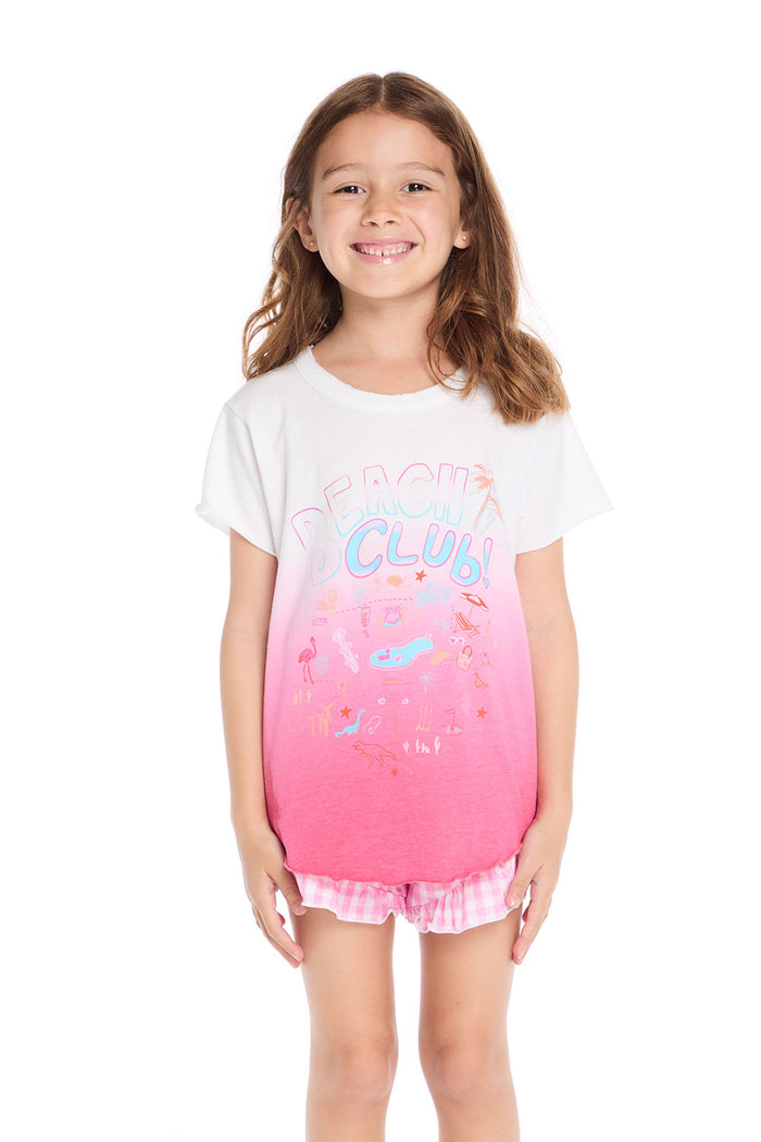 Girl wearing the Chaser Kids Beach Club Shirttail Tee in pink ombré with “Beach Club!” graphic and beach doodles on a white background