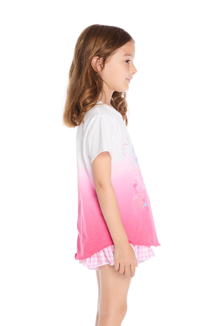Side view of the Chaser Kids Beach Club Shirttail Tee in pink ombré showing relaxed fit and curved shirttail hem on a white background