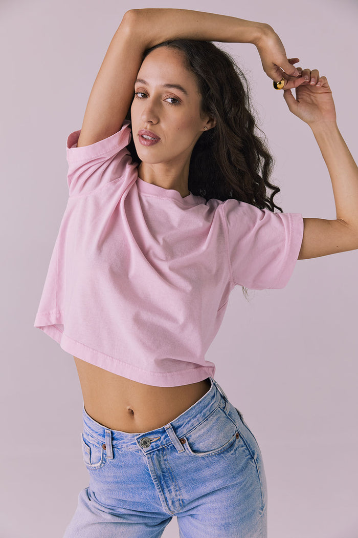 Woman wearing the Chaser Beau Nose Pink Tee featuring a boxy cropped silhouette and soft cotton texture