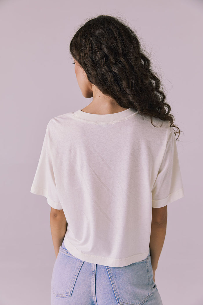 Back view of the Chaser Beau Starry White Tee highlighting the clean hemline and smooth cotton fabric