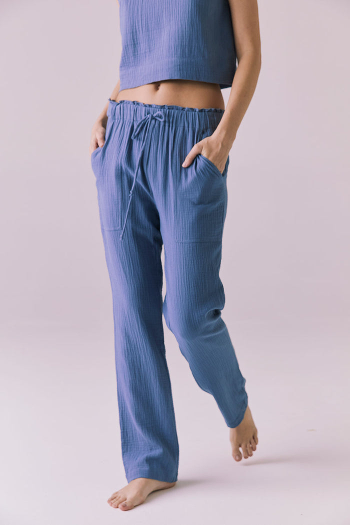 Model wearing the Chaser Bellow Future Grey Joggers featuring a relaxed fit and soft crinkle cotton texture