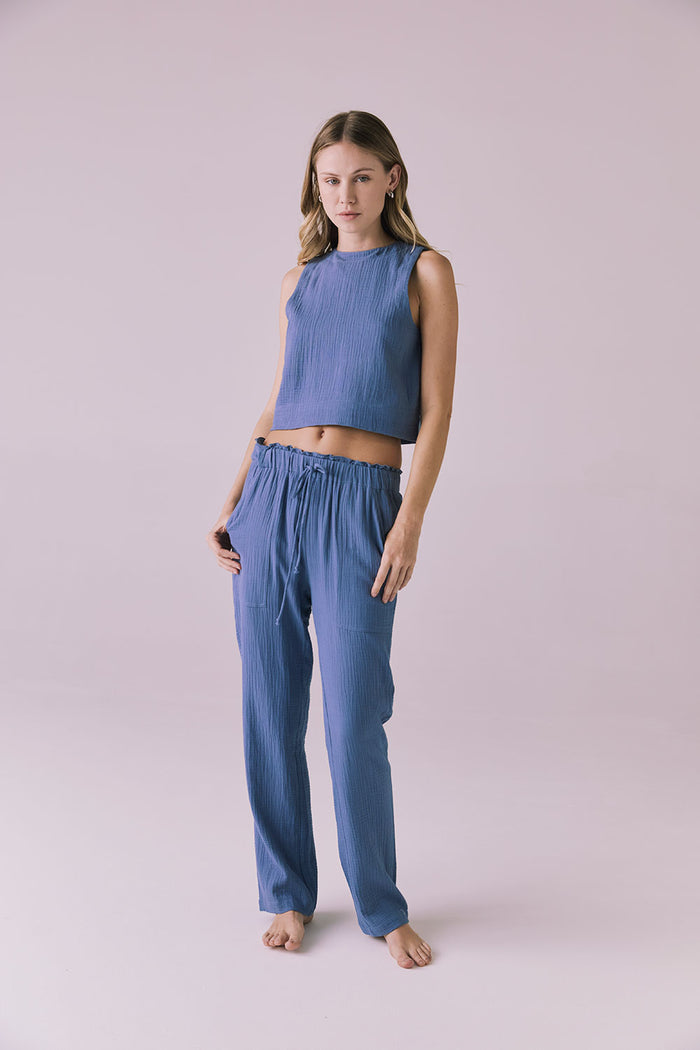 Model wearing the Chaser Bellow Future Grey Joggers paired with the matching Riley Tank for a coordinated loungewear look