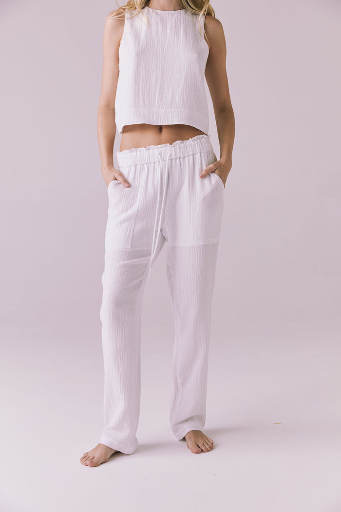 Model wearing the Chaser Bellow White Joggers featuring a relaxed fit and lightweight crinkle cotton texture