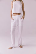 Model wearing the Chaser Bellow White Joggers featuring a relaxed fit and lightweight crinkle cotton texture