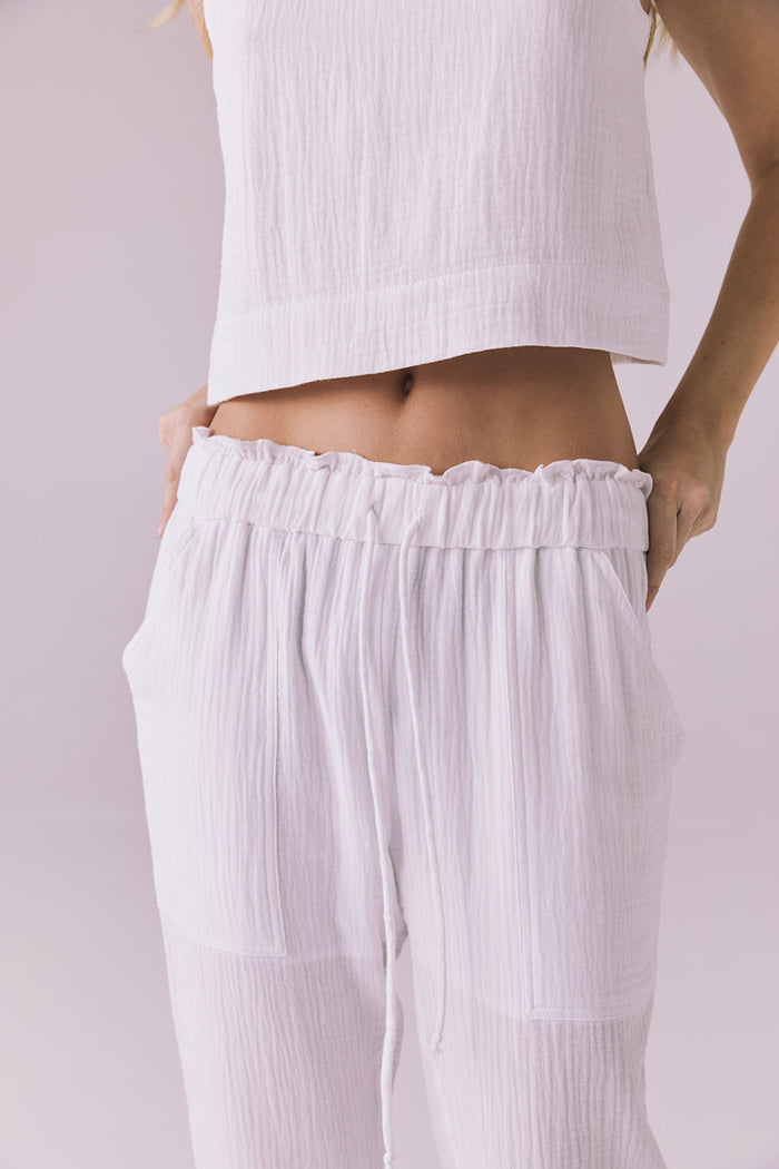 Close-up of the Chaser Bellow White Joggers highlighting the soft gauze fabric and drawstring waist