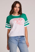 Front view of a woman wearing the Chaser  Biker Rider Graphic Tee on a neutral background