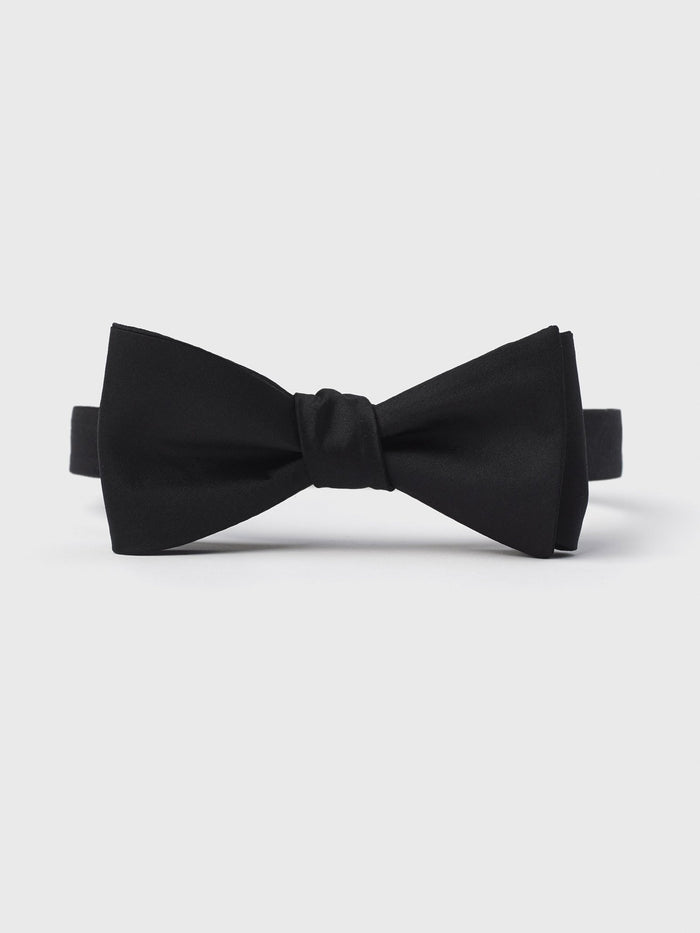 Black pre-tied butterfly bow tie shown front-on with adjustable neck strap on a white background