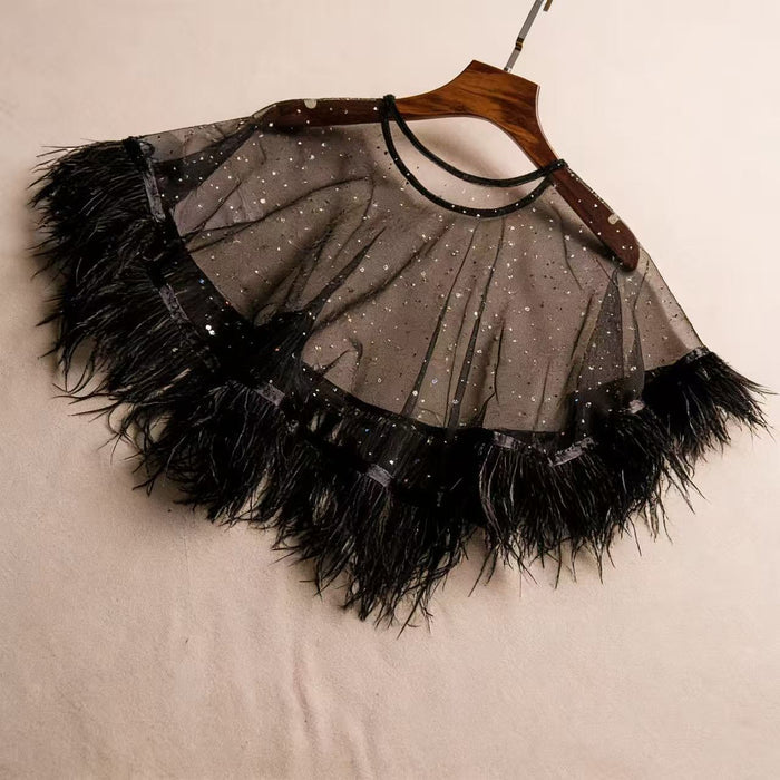 Handcrafted black feather bridal capelet featuring sheer tulle, sparkling embellishments and ostrich feather trim.