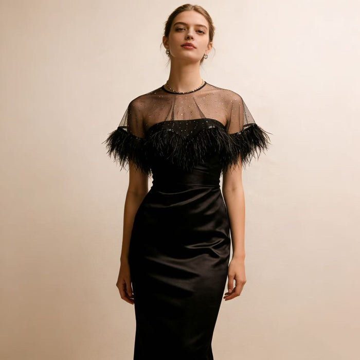 Handcrafted black feather bridal capelet featuring sheer tulle, sparkling embellishments and ostrich feather trim.