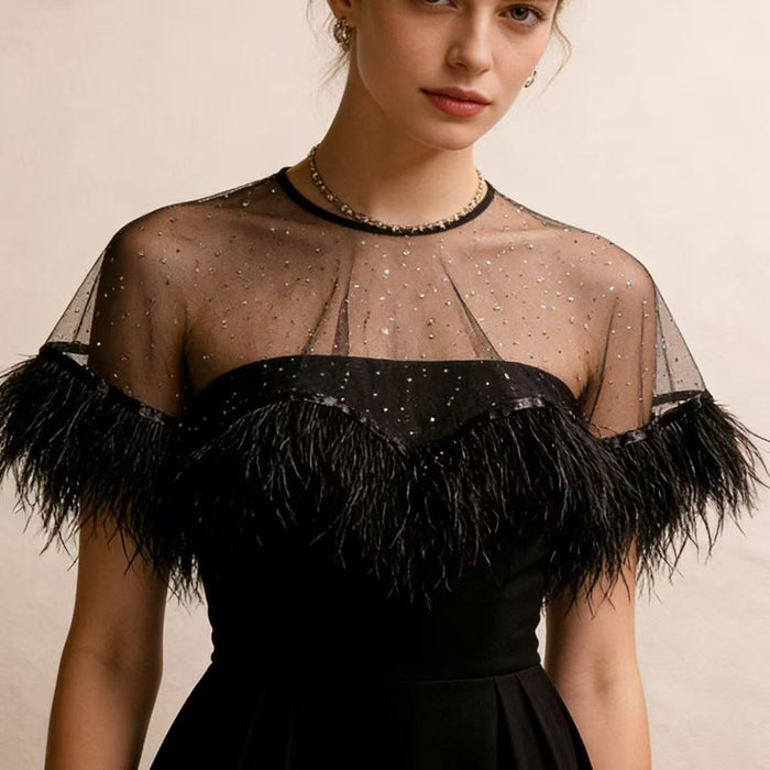 Elegant black tulle evening cape with feather trim, perfect for weddings, galas and formal occasions.