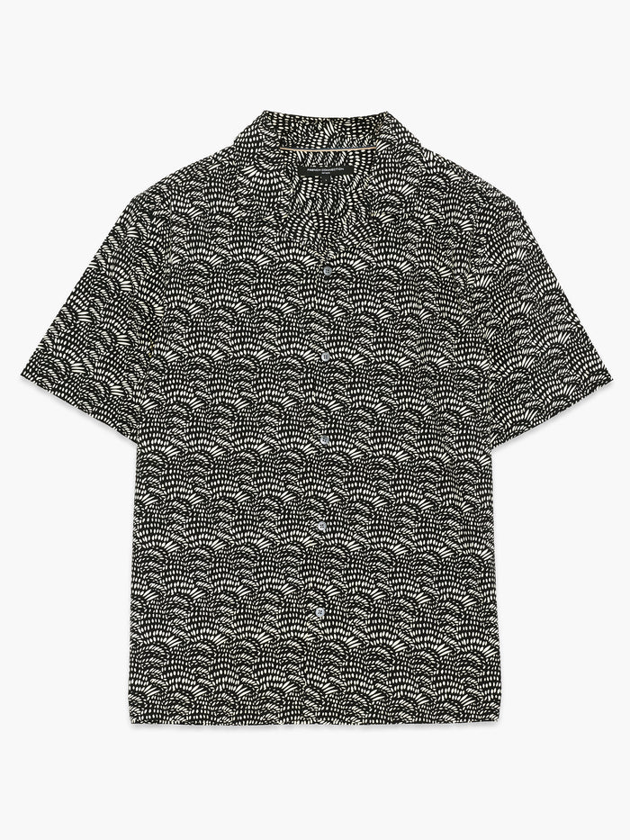 A man wearing a cotton black and cream Shirt with a geo print pattern, short sleeves, a revere collar, a button through fastening and a regular fit.